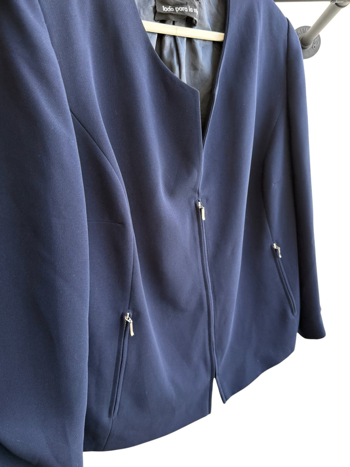 ReTrend navy blue structured blazer, size 42, with zip closure, zip pockets, and no collar. Modern chic style.