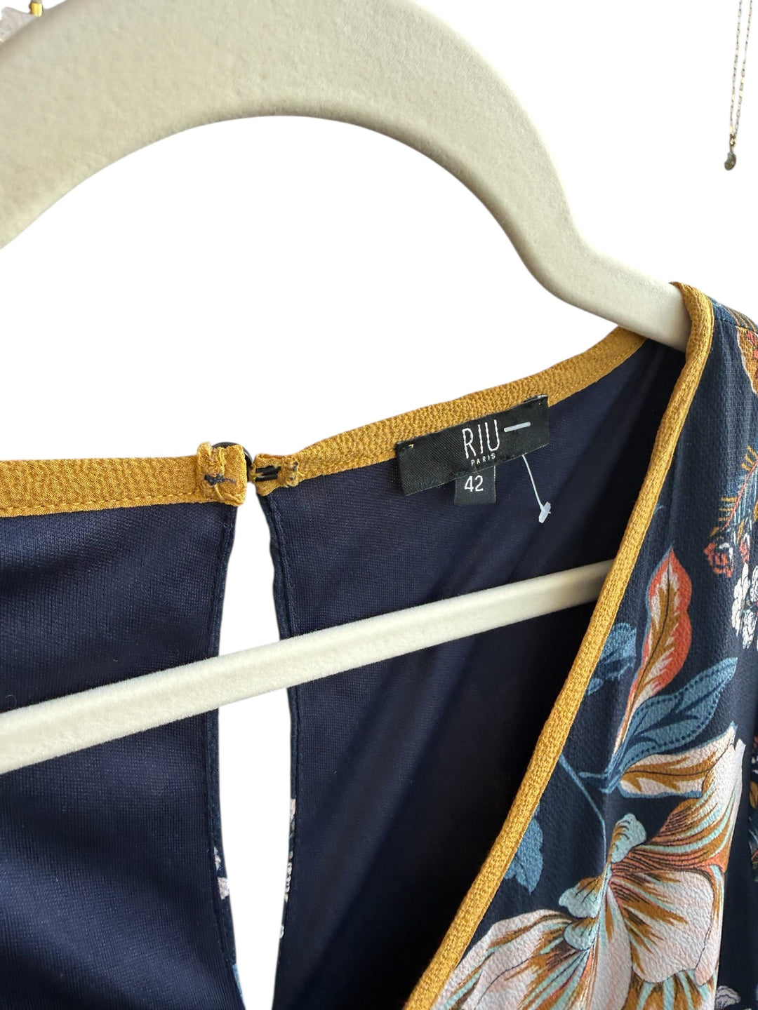 ReTrend navy blue floral print dress, size 42, with warm-toned flowers and a contrasting yellow trim.