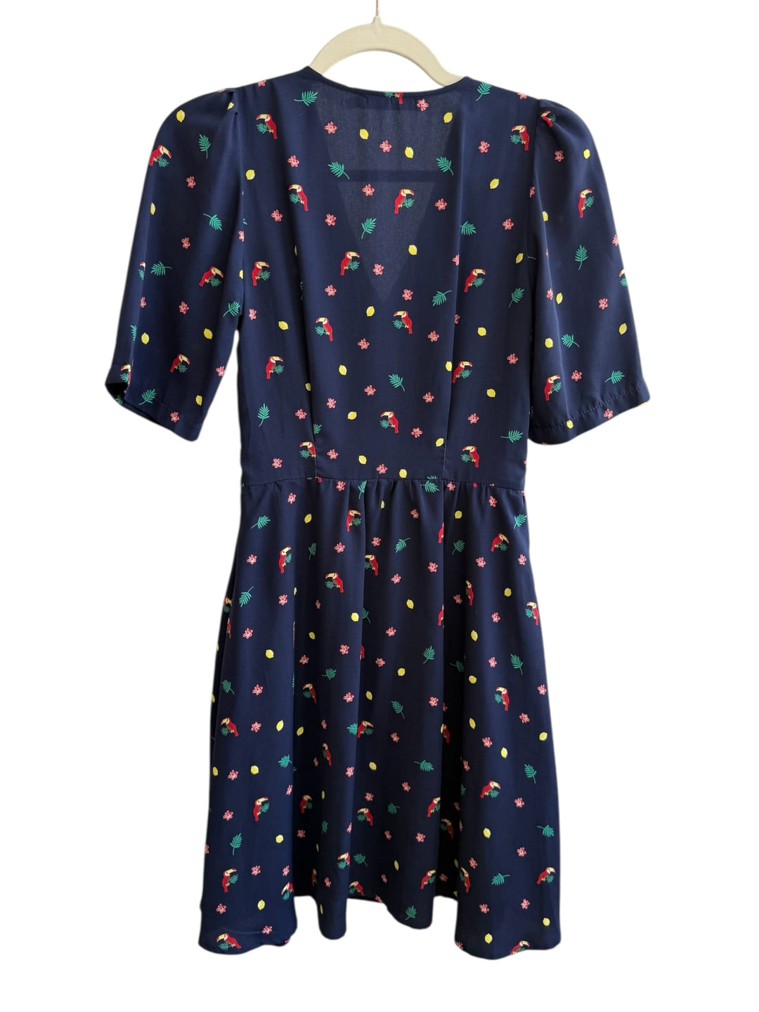 ReTrend navy blue midi dress with toucan, flower, and lemon print. Features V-neck, marked waist, and mid-length sleeves.