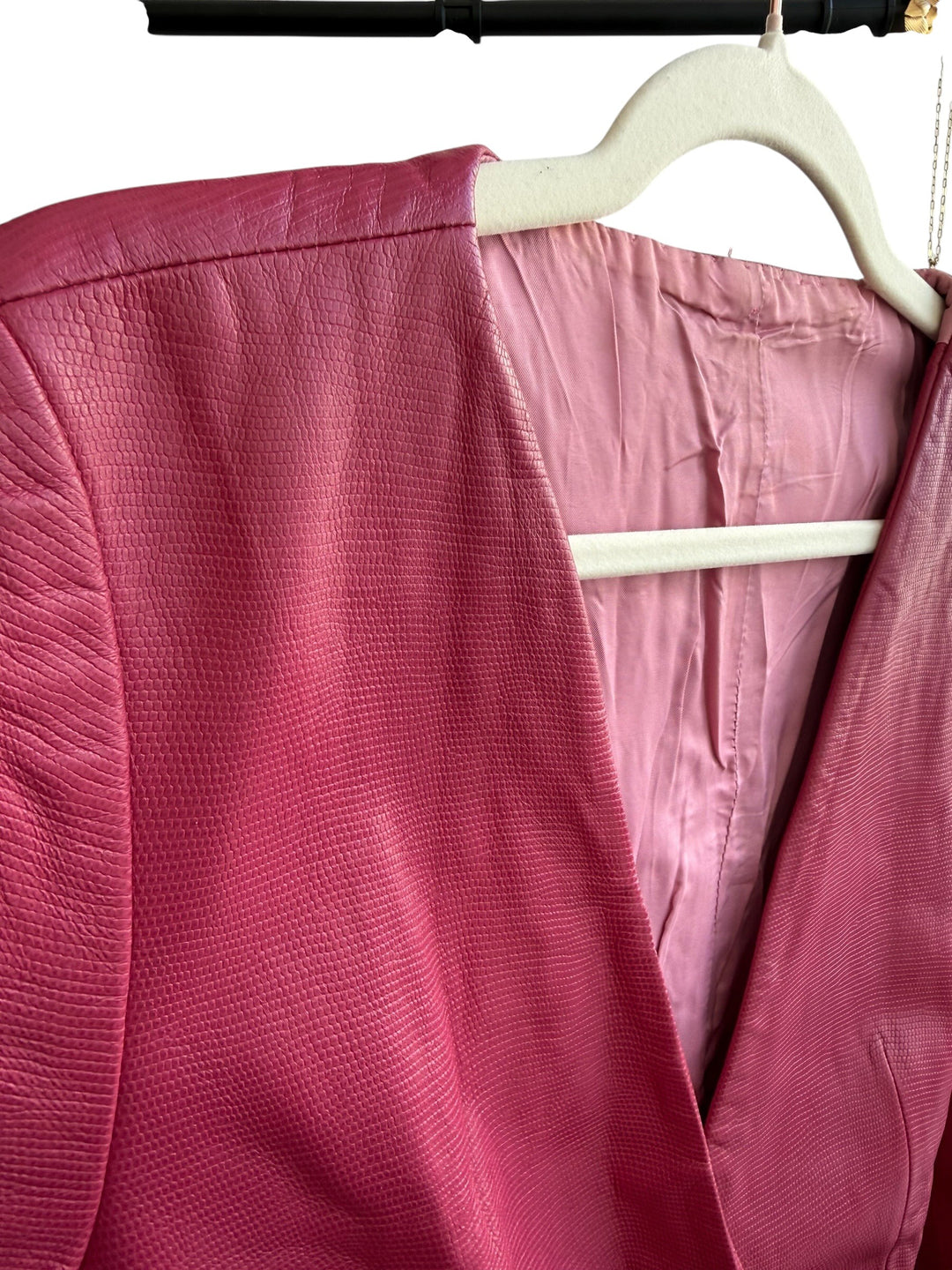 ReTrend raspberry pink 100% leather blazer, size 38. Features a textured finish, fitted cut, and covered buttons.