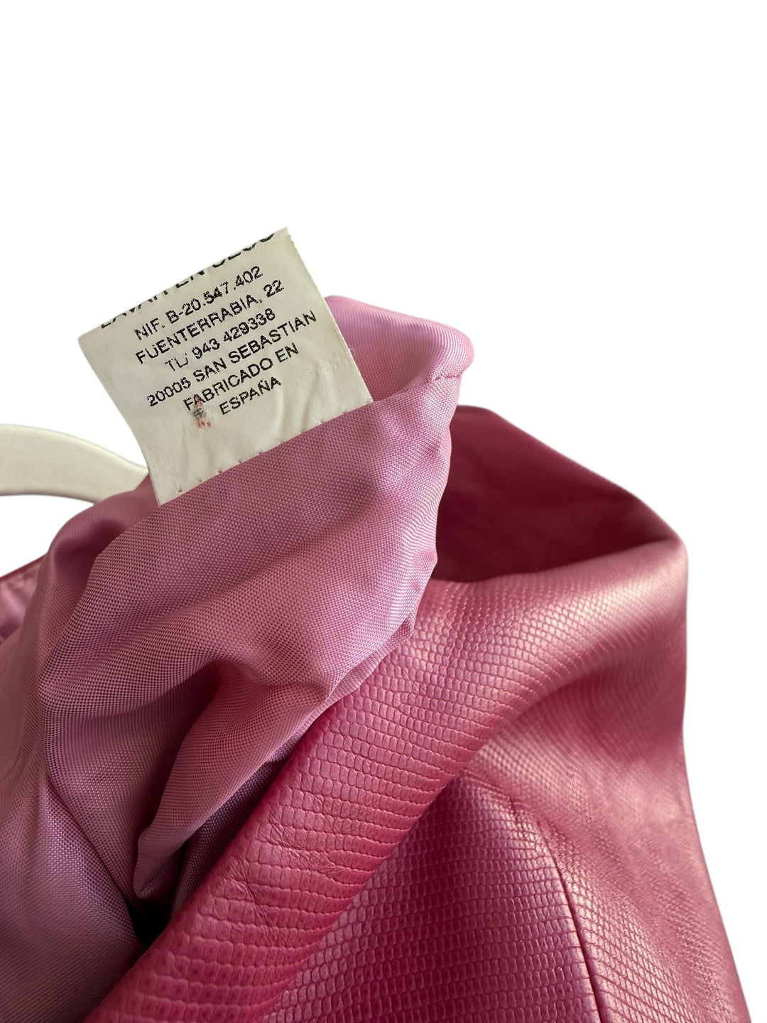 ReTrend raspberry pink 100% leather blazer, size 38. Features a cinched fit, textured finish, and covered buttons.