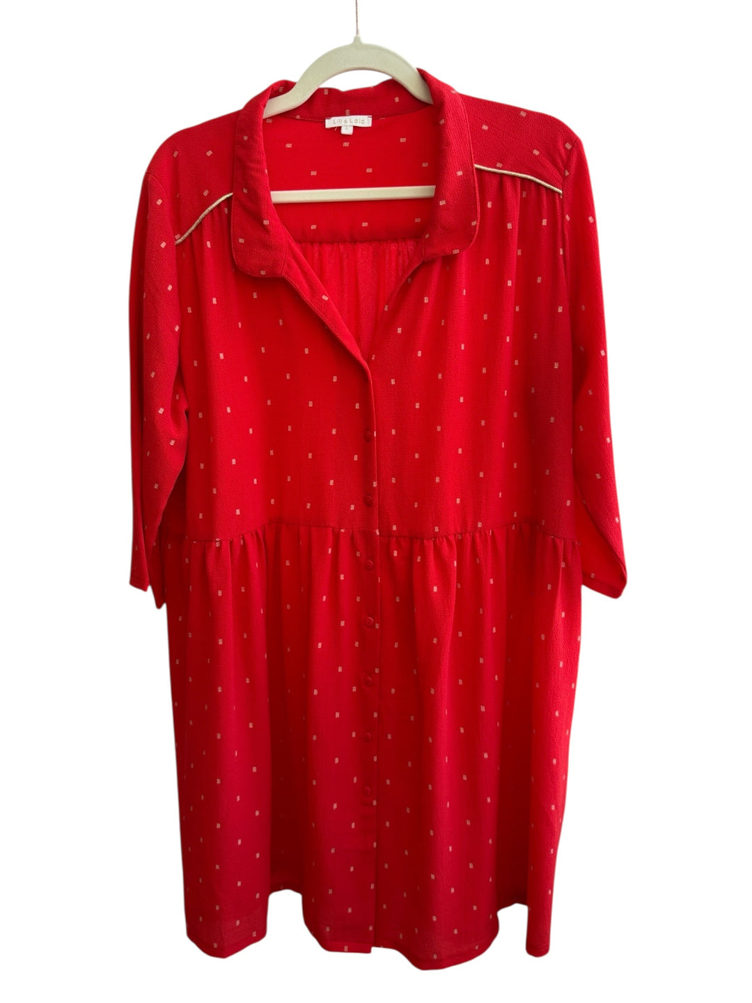 Red Lili & Lala midi dress with gold square pattern, button front, long sleeves, and gold trim detail.