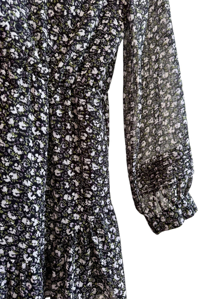 Robe Loavies noire à imprimé fleuri, col montant, manches longues transparentes et volantée. Taille S.