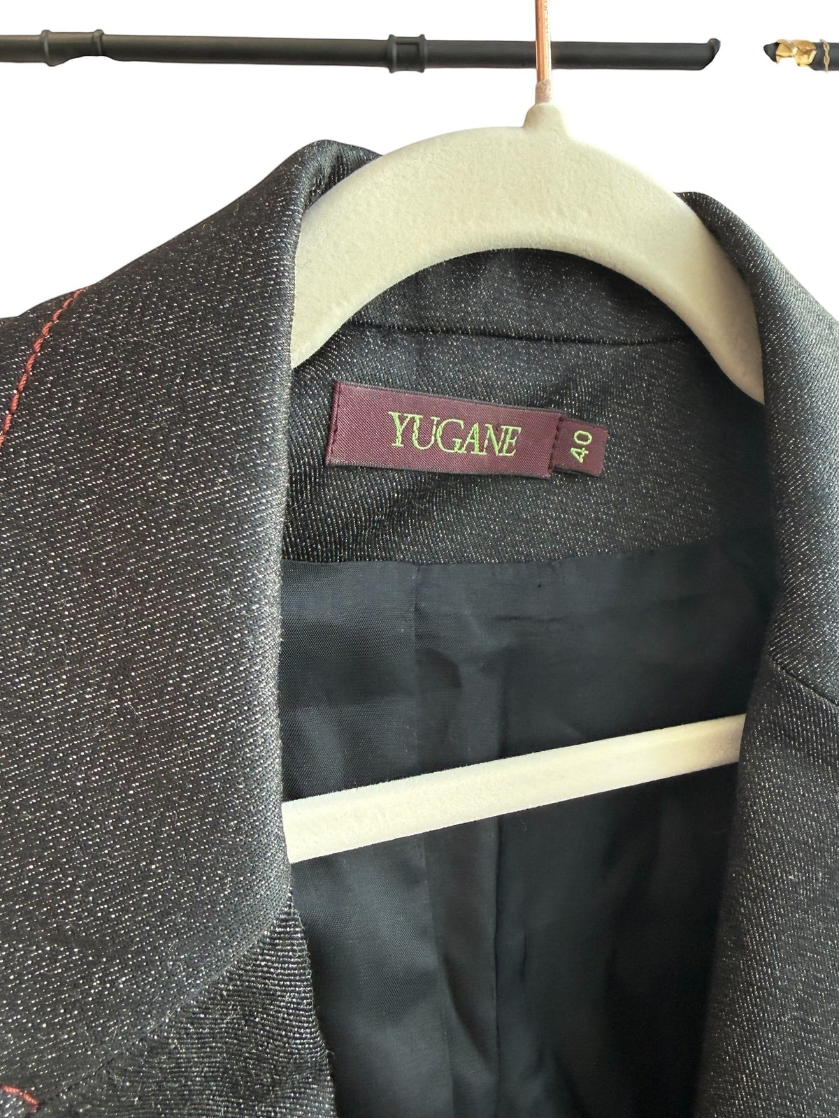 ReTrend Yugane black blazer with red contrast stitching, tailored collar, and metallic closure. Size 40.